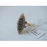 A marquise sapphire & diamond ring in 18ct gold - size Q - 5.8gms