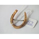 A horse shoe brooch set in gold - 2.9gms