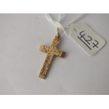 A cross pendant in 9ct - 2.6gms