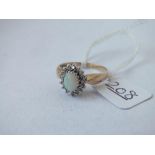 A opal & diamond ring set in 9ct - size P - 2.9gms