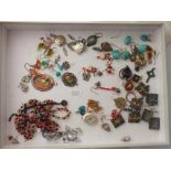 A large assortment of costume jewellery incl. earrings, brooches etc.