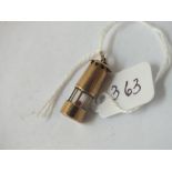 A charm in the form of a miners lamp in 9ct - 2.4gms