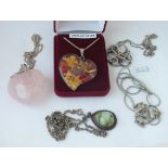 Four silver mounted pendants/necklaces incl. a rose quartz heart example