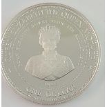 A silver Barbados proof $1 coin.