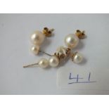 Three pairs of pearl ear studs