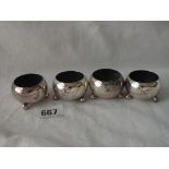 A set of 4 circular salts each on 3 ball feet - Sheffield 1912 by HA - 94gms