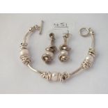 A silver & pearl bracelet & earrings