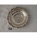 A Stirling silver dish inset with a coin dated 1893 - 90gms