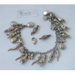 A silver charm bracelet & loose charms