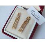 A pair of boxed gold earrings in 9ct