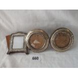 A pair of circular photo frames - 3" DIA & another easel shaped