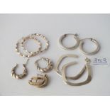 Five pairs of silver earrings