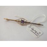 A amethyst set bar brooch in 9ct - 2.4gms