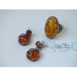 A pair of silver & amber circular ear pendants with silver & amber ring