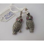 A pair of silver & marcasite owl earrings with red stone eyes