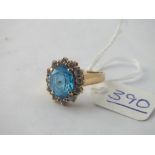 A blue stone dress ring in 14ct gold - size N - 4.8gms