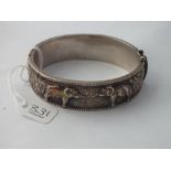 A oriental silver bracelet depicting elephants - 44gms