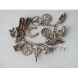 A silver charm bracelet - 69gms