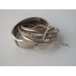 Five assorted silver bangles - 56gms
