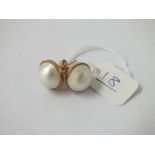 A pair of large pearl earrings in 9ct