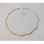 A wavy design necklace in 9ct - 5.4gms