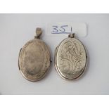 Two silver oval lockets