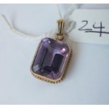 An amethyst rectangle pendant in 9ct - 4.8gms