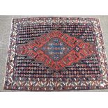A blue ground rug with flower leads - 6'6" x 4'9"