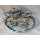 A decorative cabaret set with 2 handle tray, teapot, sugar and cream jugs + 2 cups a saucers.