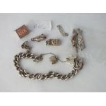 A bag containing silver charms, curb chain etc. - 44gms