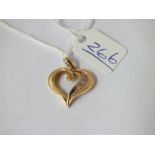 A diamond heart shaped pendant in 18ct gold - 3gms