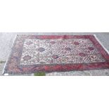 A large ivory Hamadan ground rug – red border – 7’3” x 4’2”