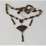 A shakudo necklace with fan motif