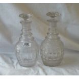 A pair of early 19th century cut glass decanters and stoppers with ringed necks
