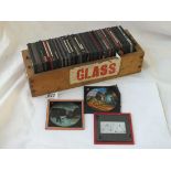 A box containing coloured glass slides - approx 65