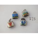 Four continental silver and enamel cow bell charms marked 800