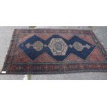 A blue ground rug with pole medallion – 7’ x 4’3