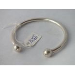 A silver torque bangle