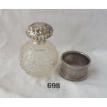 A scent bottle with top suitable as a sugar sprinkler and a napkin ring