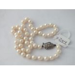 A pearl necklace with silver & marcasite clasp