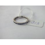 A white gold sapphire eternity ring (stones missing) - size K