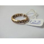 A stone set eternity ring in 9ct - size M - 2.5gms