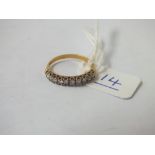 A diamond half hoop ring set in 18ct gold - size L - 2.1gms