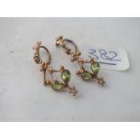 A pair of peridot earrings in 9ct - 2gms