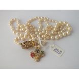 A FANCY PEARL NECKLACE WITH 9CT & EMERALD CLASP & 18CT GEM SET BASKET OF FLOWERS PENDANT