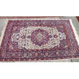A ivory ground rug with blue border - 7' x 4'
