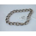 A silver curb link bracelet - 31.6gms