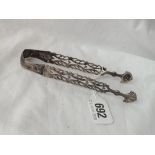 A pair of George III sugar tongs with cast arms by TW