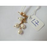 A pair of pearl double drop earrings in 14ct gold