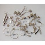 Thirty pairs of silver earrings - 79gms